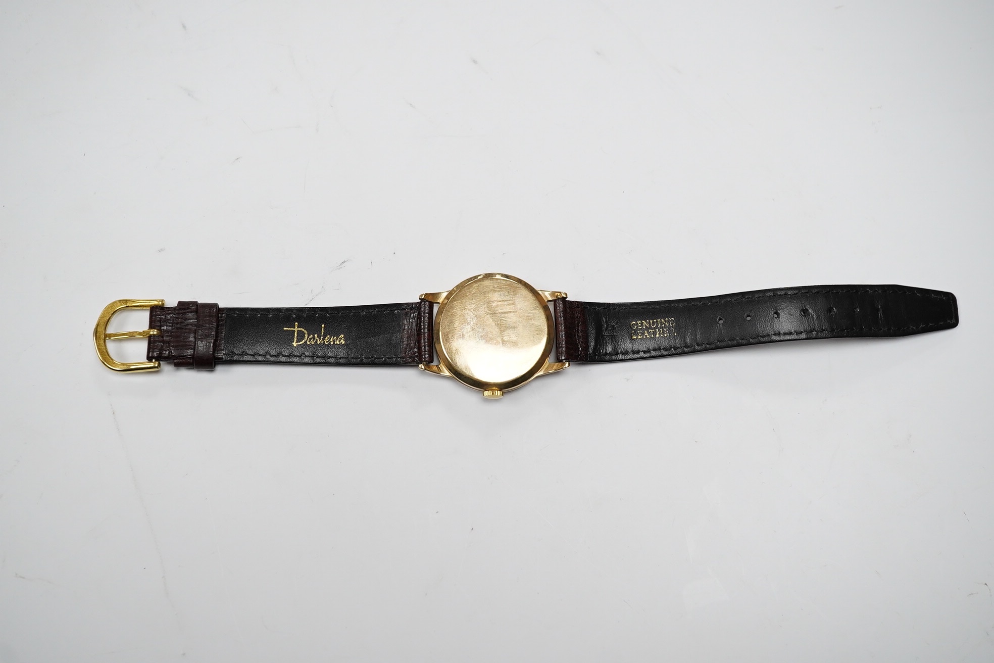 A gentleman's 9ct gold Ernest Borel manual wind wrist watch, with baton numerals and date aperture, case diameter 31mm, on a leather strap. Condition - fair